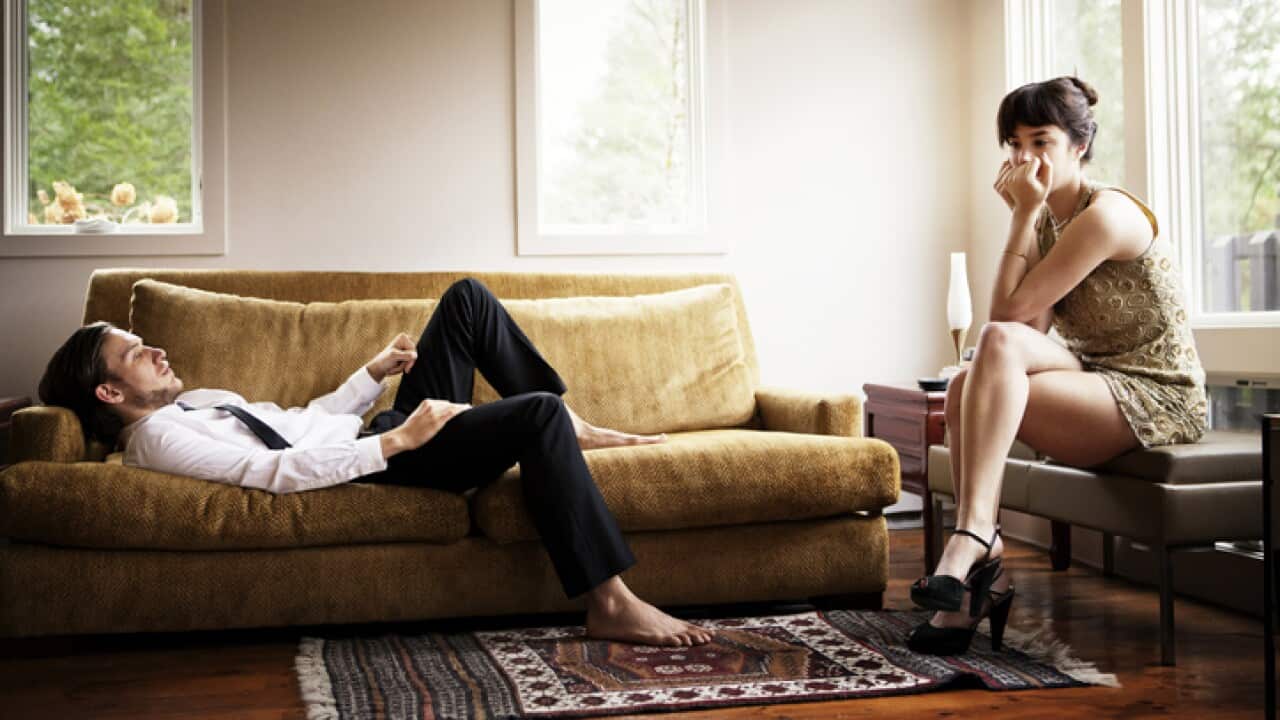 Unhappy couple in living room
