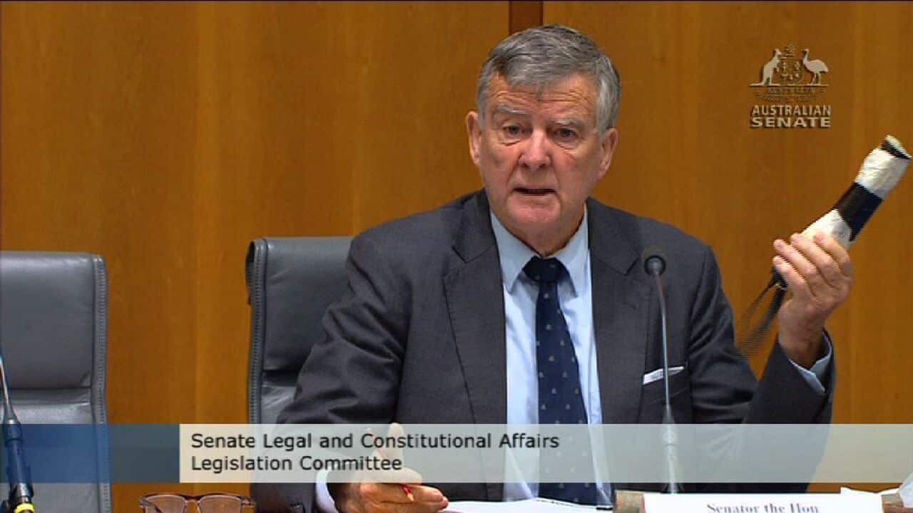 Liberal senator Bill Heffernan smuggles a 'pipe bomb' to underline lax parliament house security. (Screenshot: SBS)