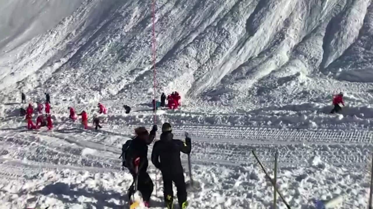 In this image taken from video, rescue personnel work at the site of an avalanche at Lavachet Wall in Tignes, France, Monday Feb. 13, 2017