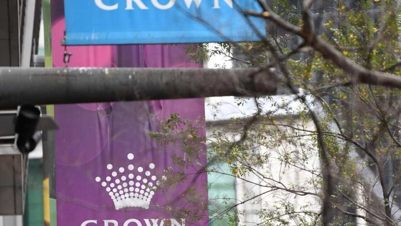 a line of banner flags with Cron logo hanging amid trees.