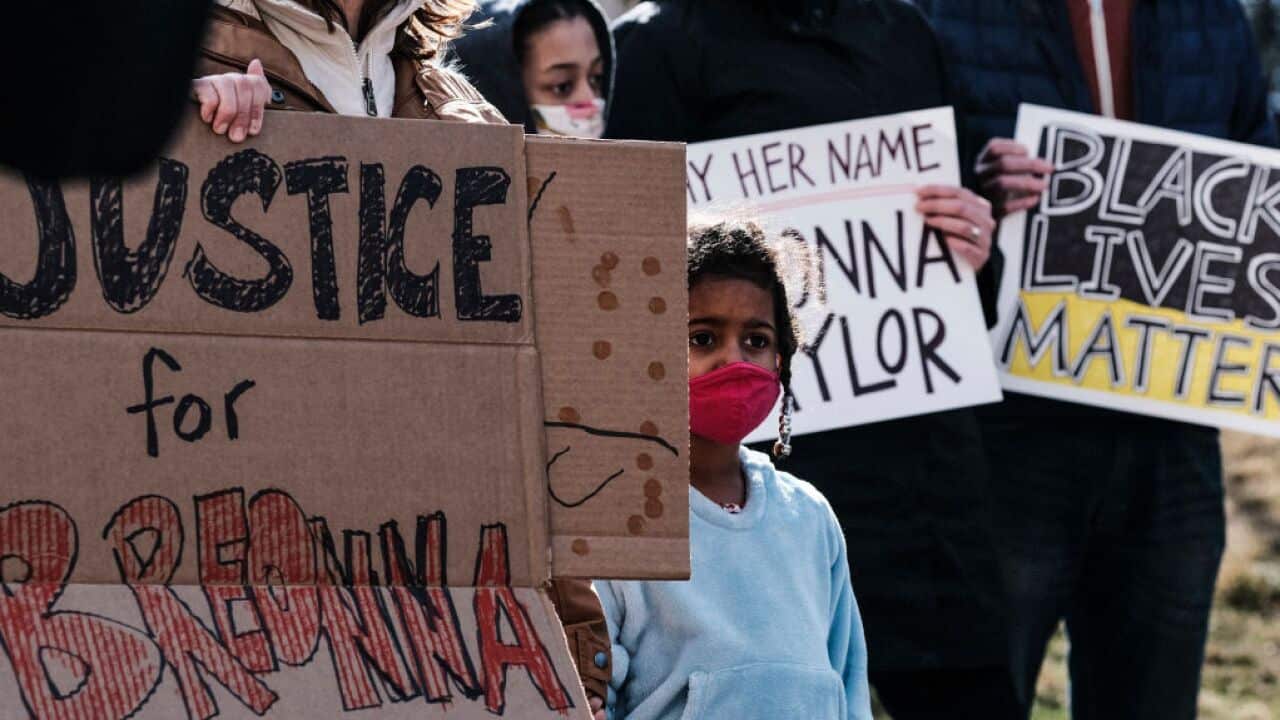 Protesters march through the streets in Grand Rapids, Michigan, in protest and remembrance of the killing of Breonna Taylor.
