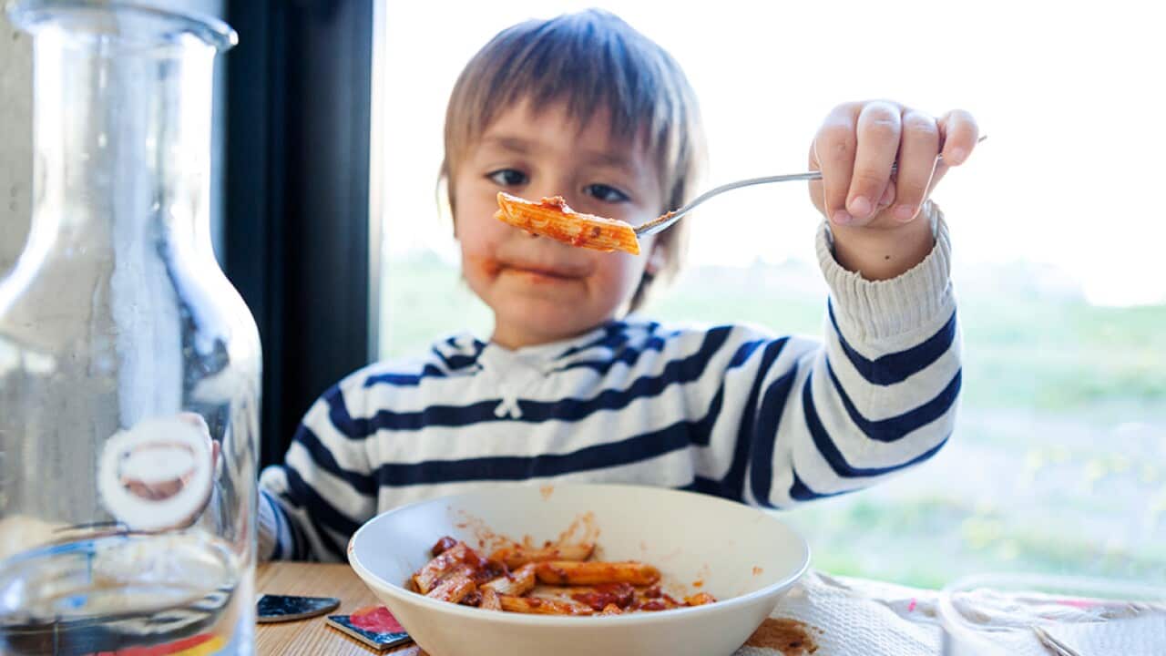 Child eating pasta