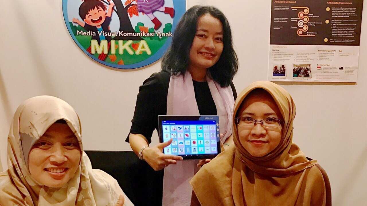 Margaretha (centre) and her team at the launch of ‘Study App for children with autism (MIKA)’ at the Australian Alumni Dinner in 2019. (Supplied).