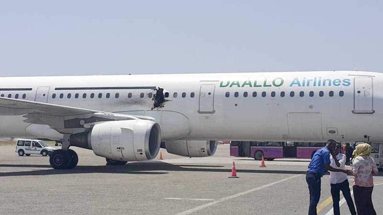 A gaping hole in the commercial airliner forced it to make an emergency landing at Mogadishu's international airport late Tuesday.