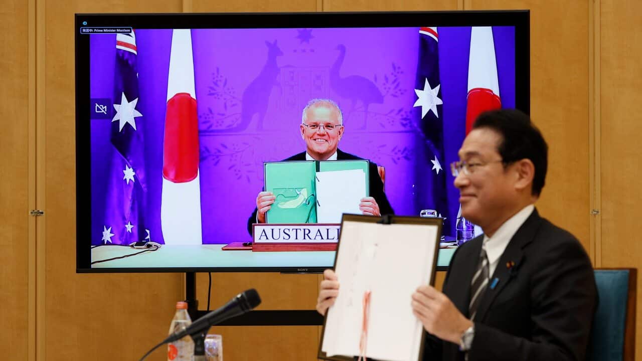 Japan's Prime Minister Fumio Kishida and Australia's Prime Minister Scott Morrison
