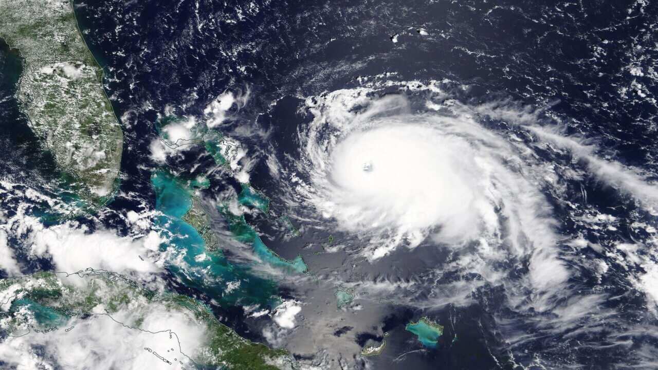 A handout photo made available by NASA on 01 September 2019 shows Hurricane Dorian over the Atlantic Ocean approaching the Bahamas