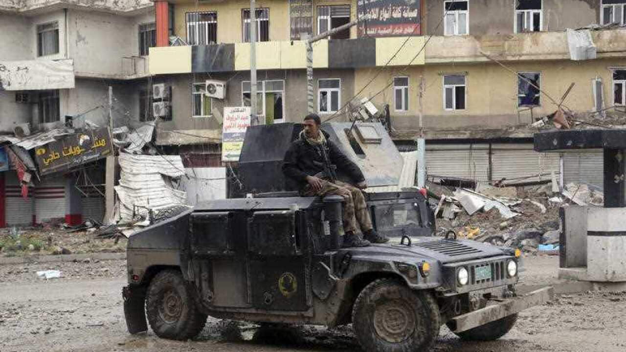 Iraq's special forces troops patrol in the eastern side of Mosul, Iraq
