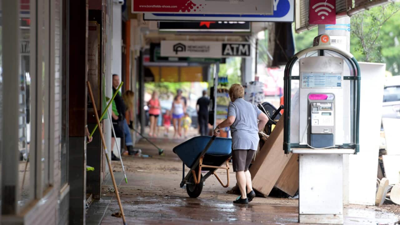 Locals clean debris in the centre town centre Lismore