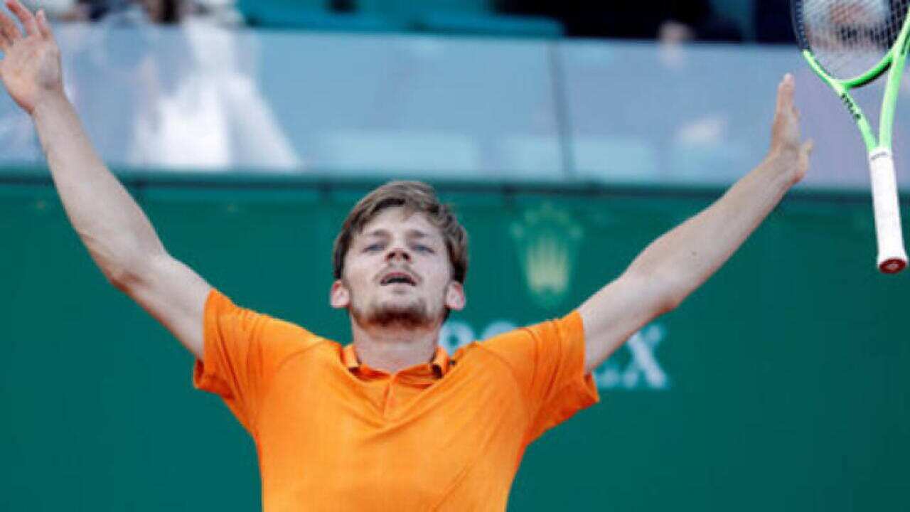 Monte Carlo Masters - David Goffin of Belgium reacts after defeating Novak Djokovic of Serbia