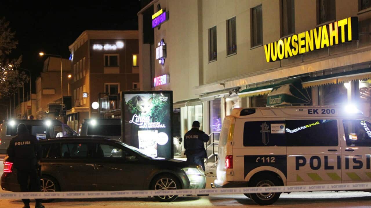 Police inspect a site of a shooting in Imatra