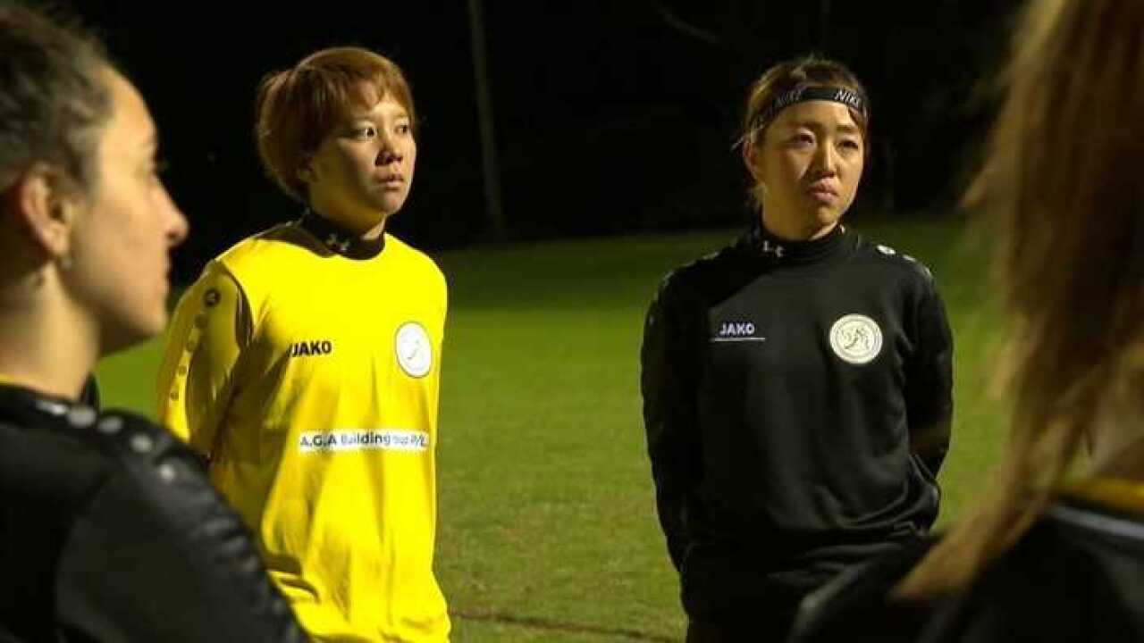 Japanese fans Miki Onodera and Eri Namita