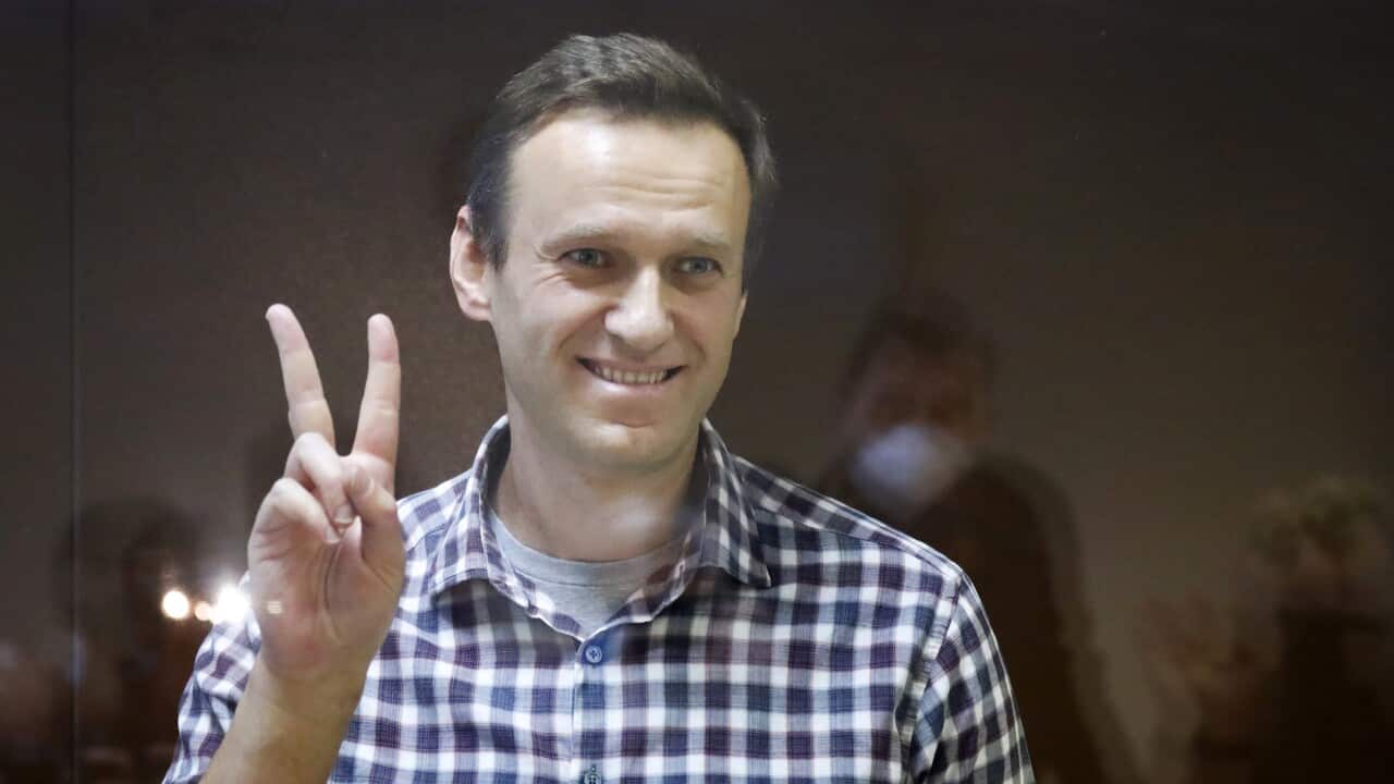 FILE - In this Saturday, Feb. 20, 2021 file photo, Russian opposition leader Alexei Navalny gestures as he stands in a cage in the Babuskinsky District Court in Moscow, Russia. Navalny, whom many regarded as a top candidate for the Nobel Peace Prize, is o