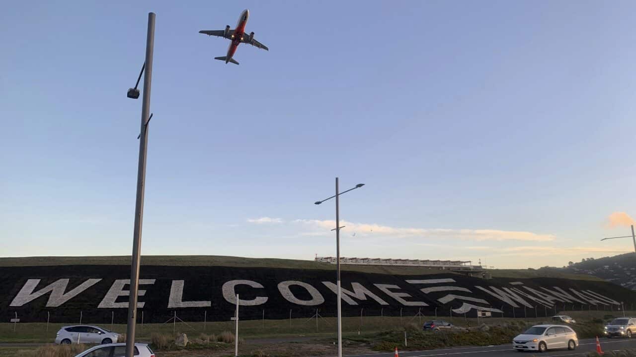 A giant 'Welcome' sign is painted near the main runway of the Wellington International Airport.