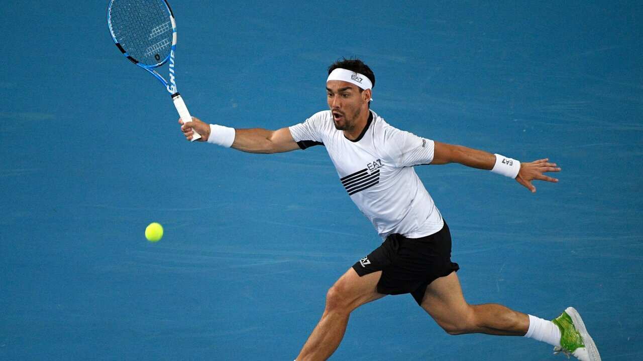 Italy's Fabio Fognini makes a forehand return to Australia's Jordan Thompson during their second round singles match at the Australian Open tennis championship in Melbourne, Australia, Wednesday, Jan. 22, 2020. (AP Photo/Andy Brownbill)