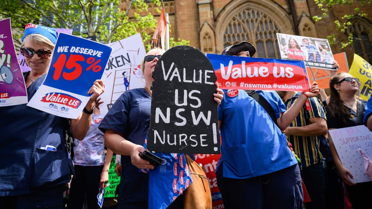 Protesters holding placards