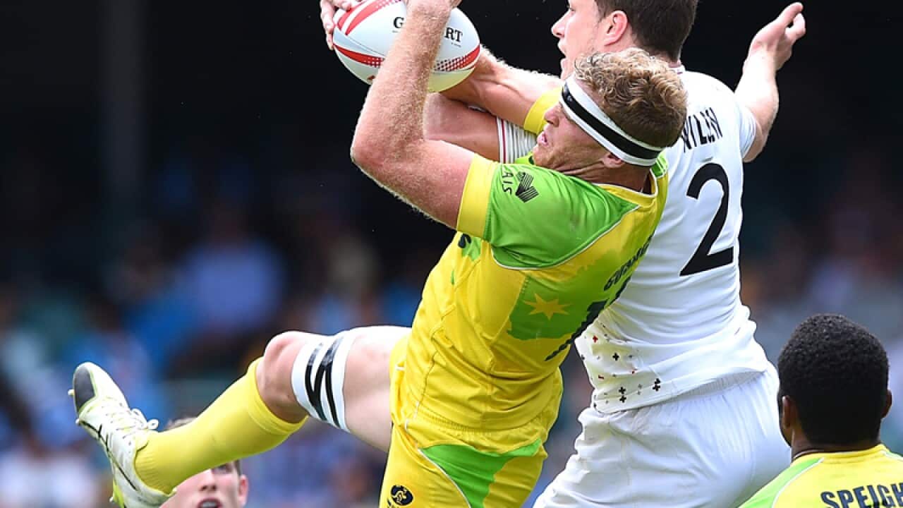 Tom Cusack of Australia competes and Jack Wilson of England