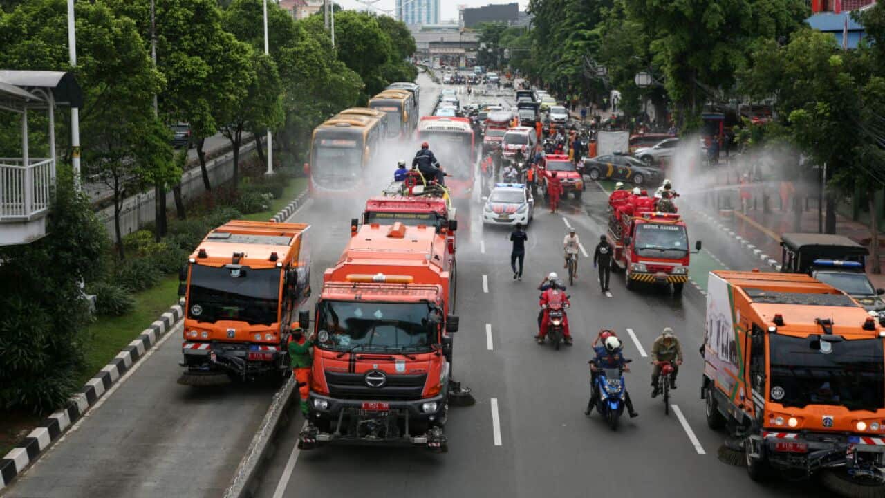 A number of major roads on bus routes in Jakarta are sprayed