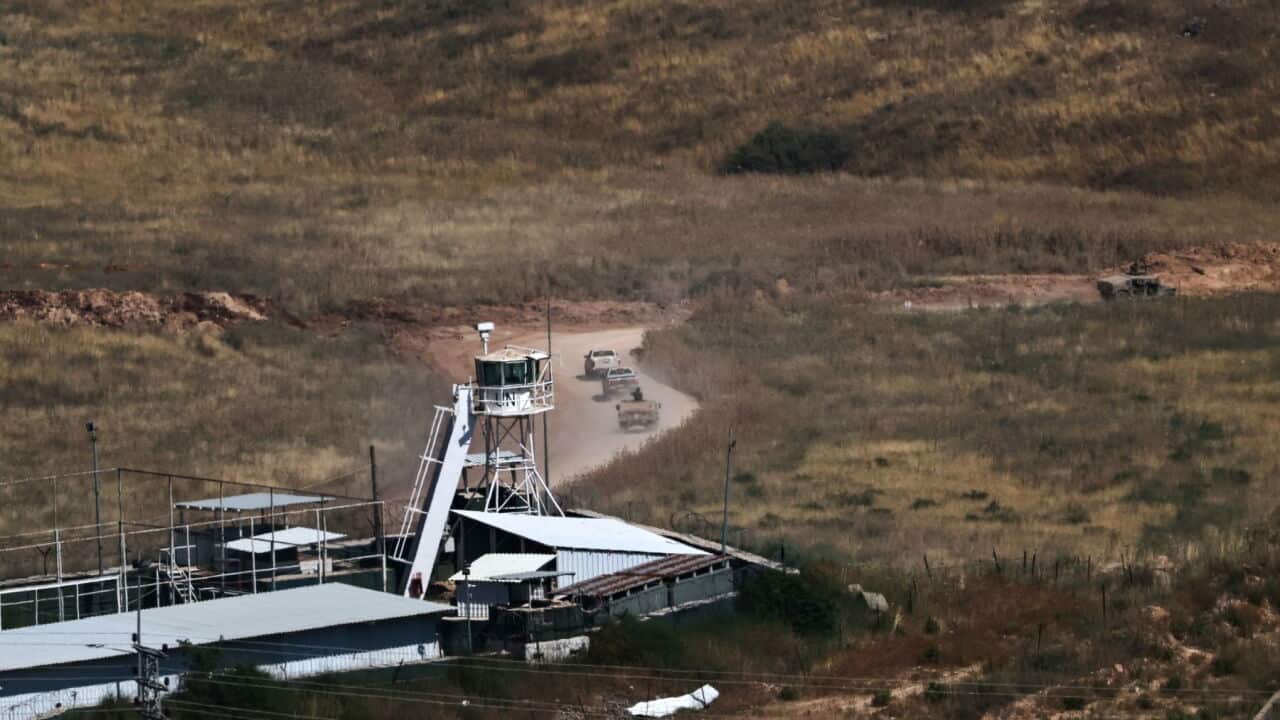 Israeli military vehicles drive past a United Nations Interim Force in Lebanon (UNIFIL) base within southern Lebanon, as seen from the Israeli side of the border in the Upper Galilee (EPA-ATEF SAFADI).jpg