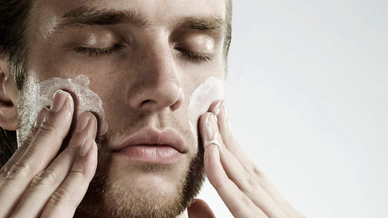 Man applying moisturiser
