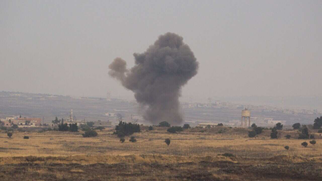 Smoke rise from Syrian village