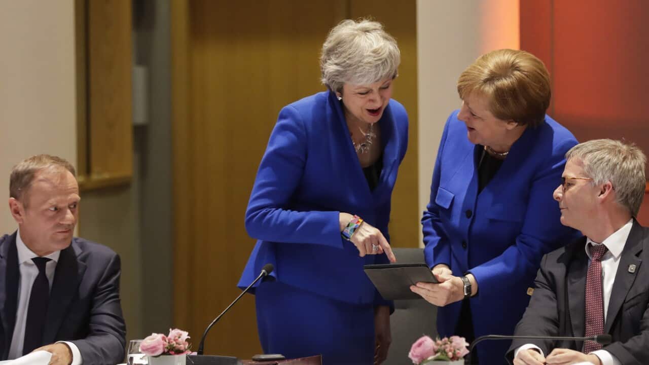 European Council President Donald Tusk, left, looks on as British Prime Minister Theresa May, center left, and German Chancellor Angela Merkel.