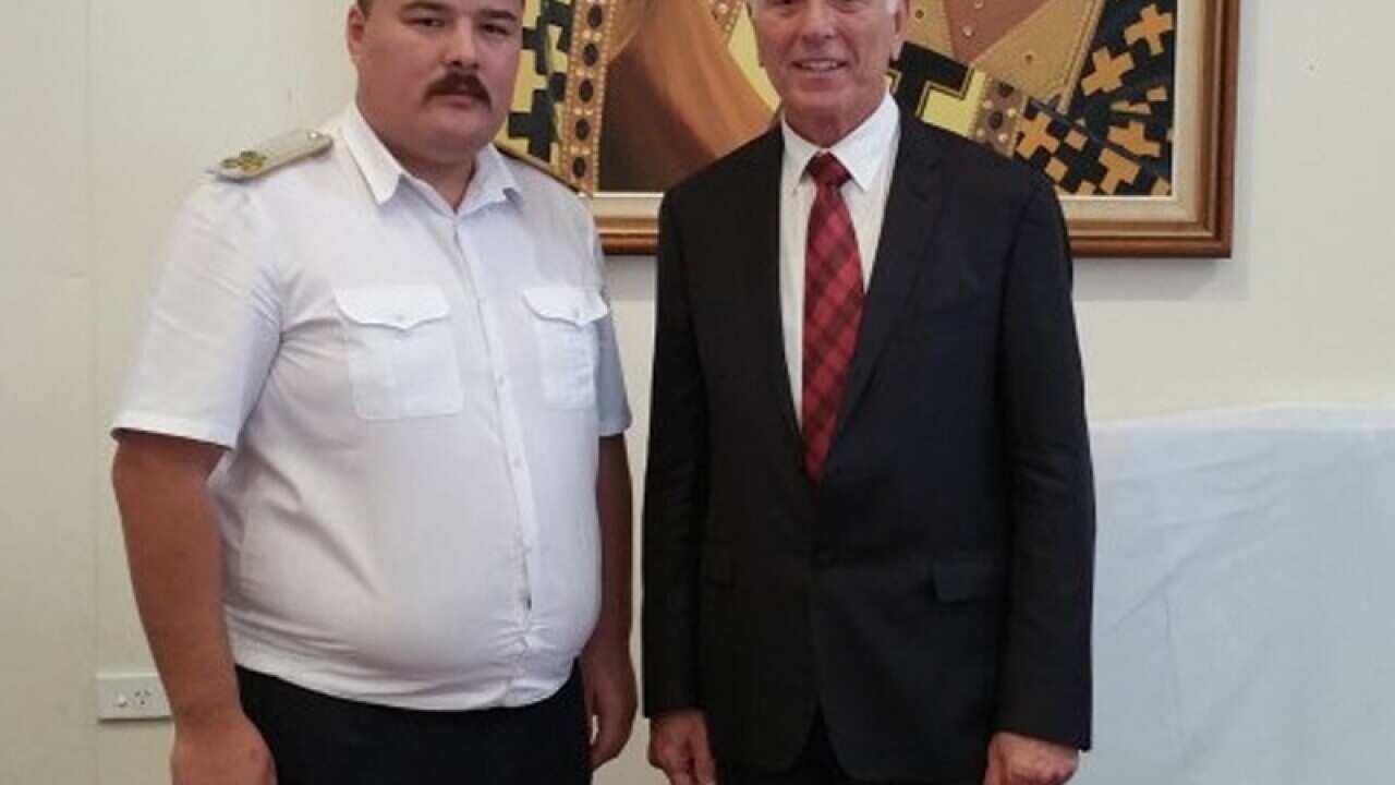 Semyon Boikov (L) posing for a picture with NSW Labor MP Nick Lalich