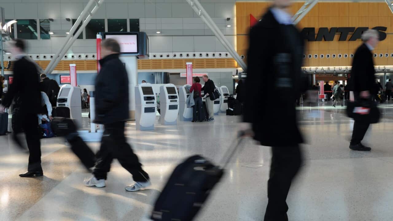 File image: Passengers checking in at the QANTAS domestic terminal at Sydney Airport,