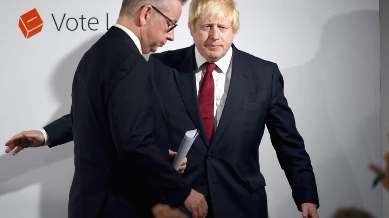 Boris Johnson (R) and British Lord Chancellor Michael Gove