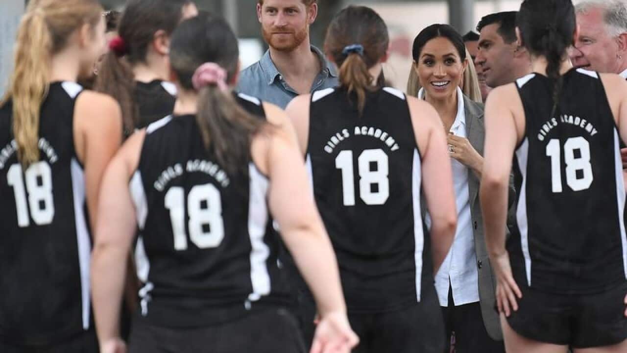 Harry and Meghan meet netballers at a Dubbo high school.