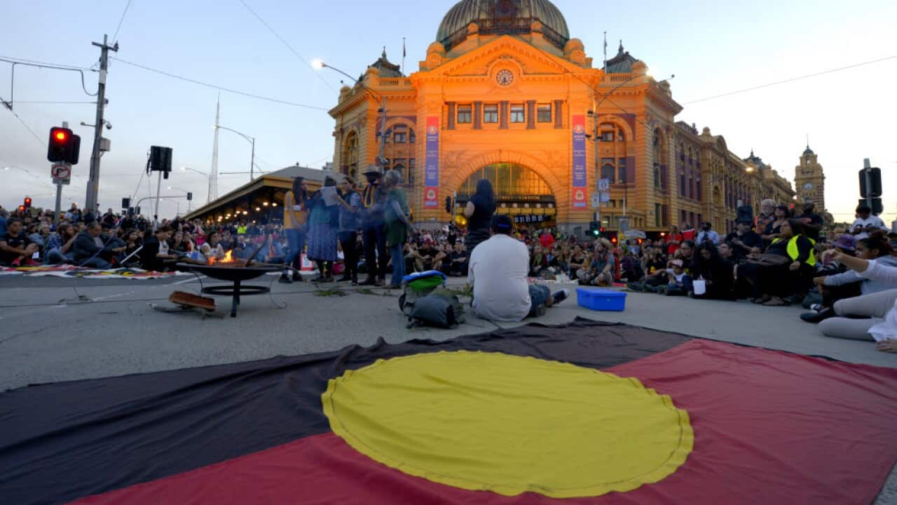 An aboriginal flag lies on the ground during a protest in Melbourne