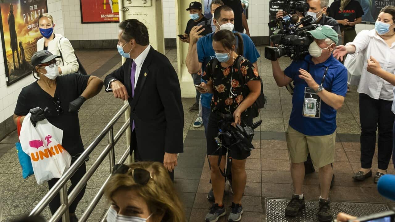 Governor Andrew Cuomo greets commuter after riding the New York City subway (AAP)