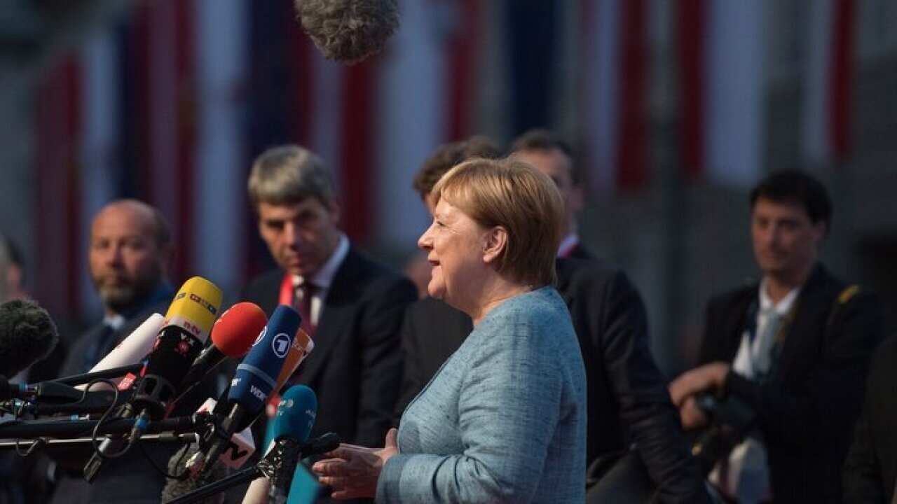 German Chancellor Angela Merkel (C) in Salzburg, Austria, 19 September 2018.