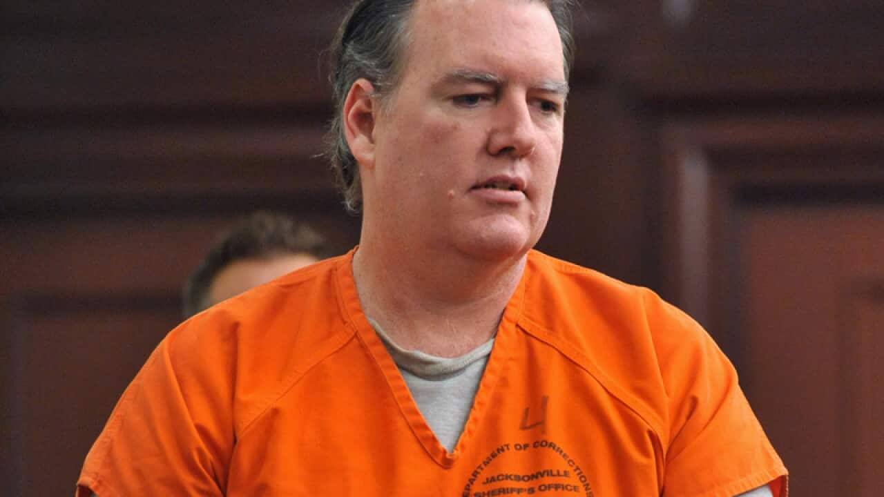 Michael Dunn enters the courtroom