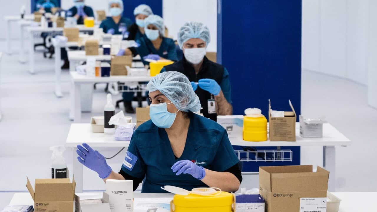 SYDNEY, AUSTRALIA - MAY 10: Staff prepare COVID-19 vaccines in the pharmacy area at the Olympic Park Vaccination Centre on May 10, 2021 in Sydney, Australia. The mass vaccination centre at Sydney Olympic Park is equipped to administer 30,000 vaccine doses