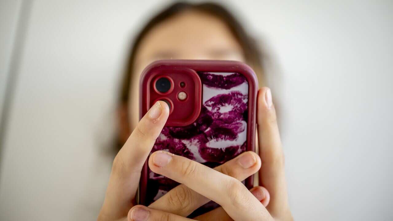 A teenage girl on her cell phone