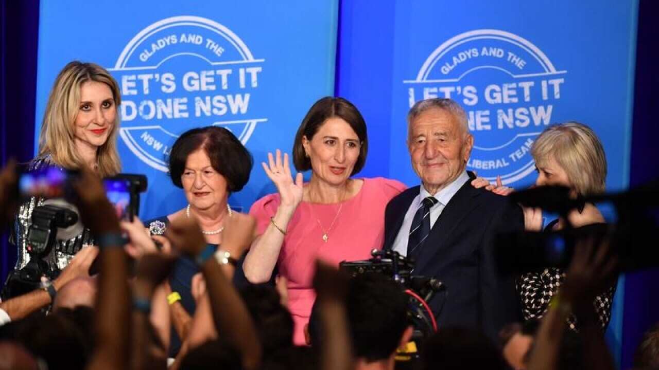 NSW Premier Gladys Berejiklian with her family on election night.