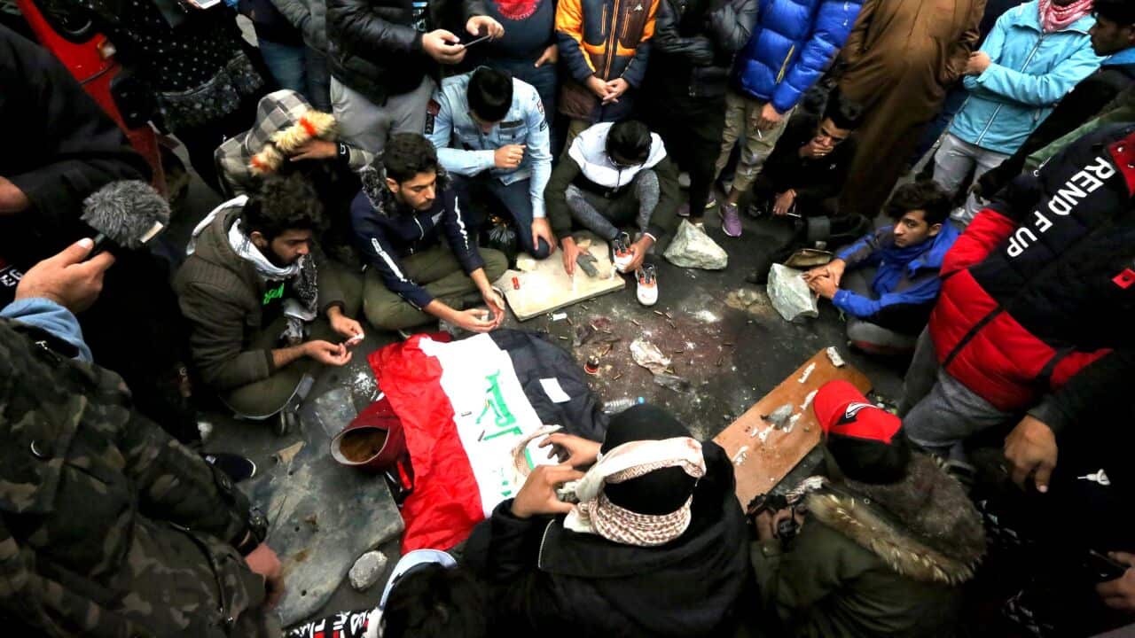 Crowds mourn and pray at the site where protesters were killed wounded at Al-Khilani square in the capital Baghdad.