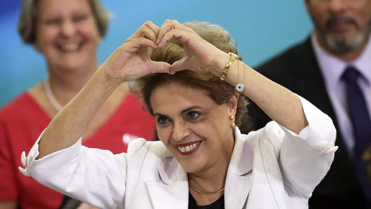 Brazilian President Dilma Rousseff gestures to students and teachers at Planalto Palace in Brasilia, Brazil, 12 April 2016.
