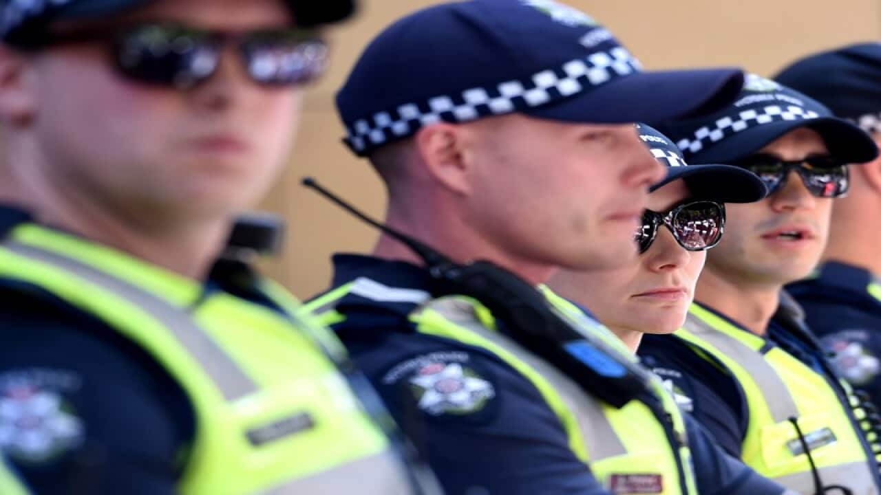 Female police officers with their male collegues