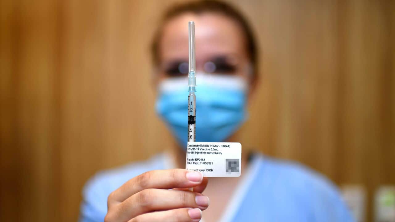 A nurse holds up a syringe containing the COVID-19 Pfizer vaccine at STARS Metro North Health facility, in Brisbane.