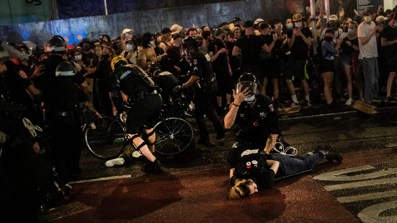 Police arrest protesters who broke curfew by marching through Manhattan, New York during a solidarity rally Wednesday, June 3, 2020