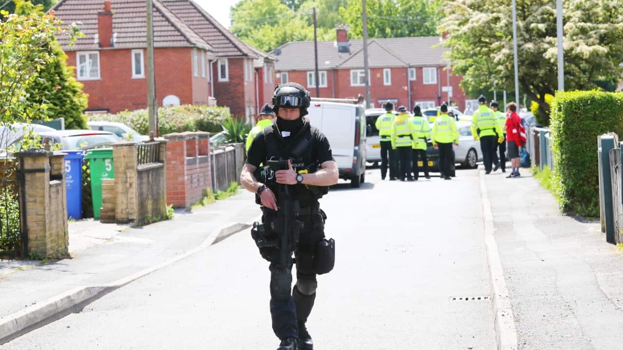 Police raid a house on Elsmore Road in Fallowfield, South Manchester.