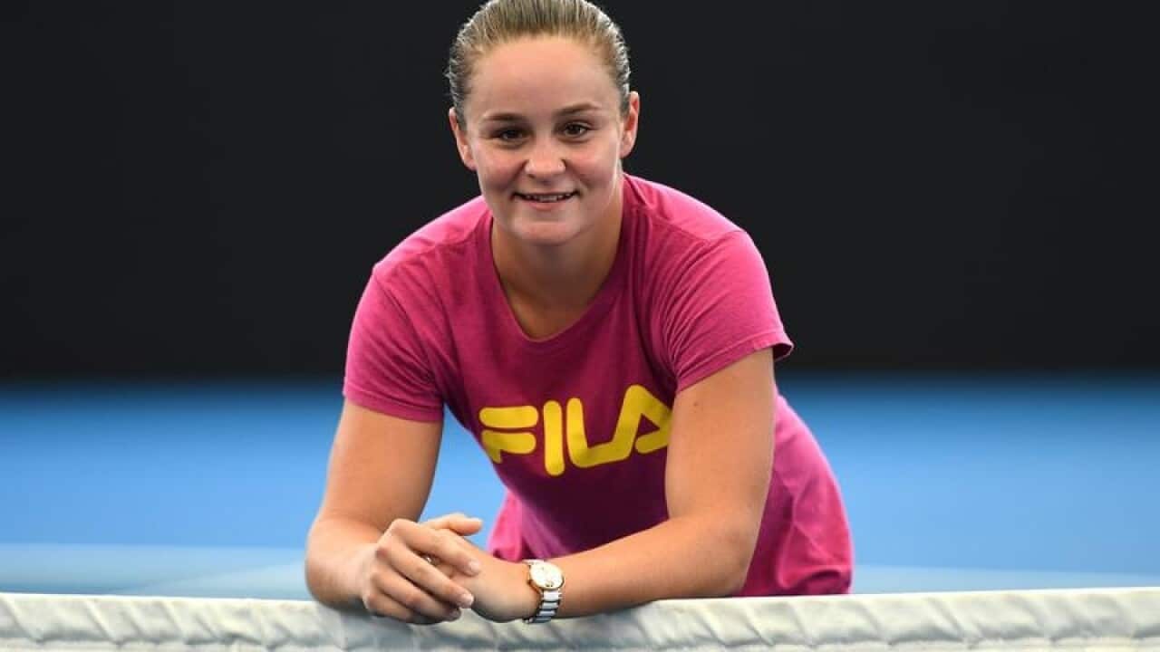 Ashleigh Barty poses for photos at Pat Rafter arena in Brisbane