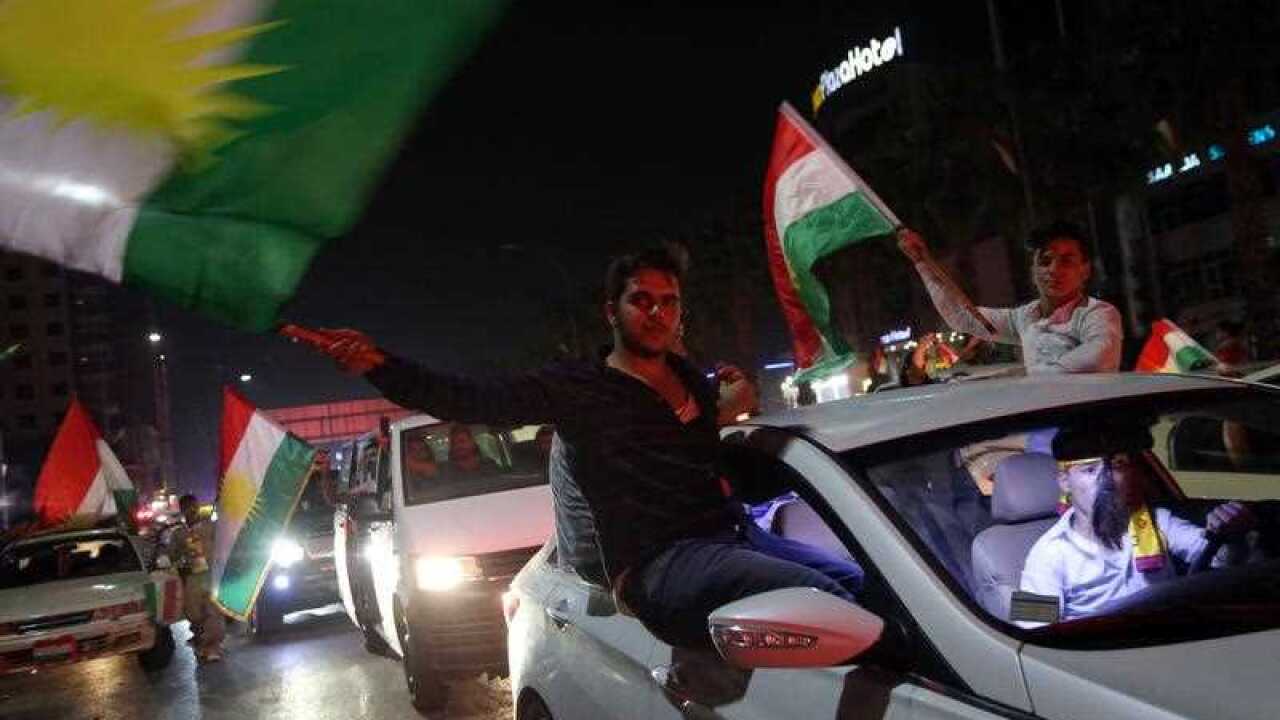 Kurdish people celebrate in streets after the Kurdistan independence referendum in Erbil northern Iraq, 25 September 2017.