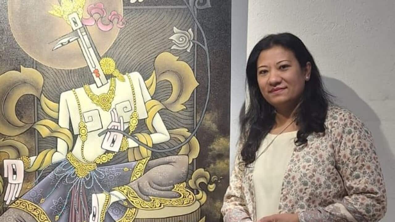 Sangee Shrestha with the painting