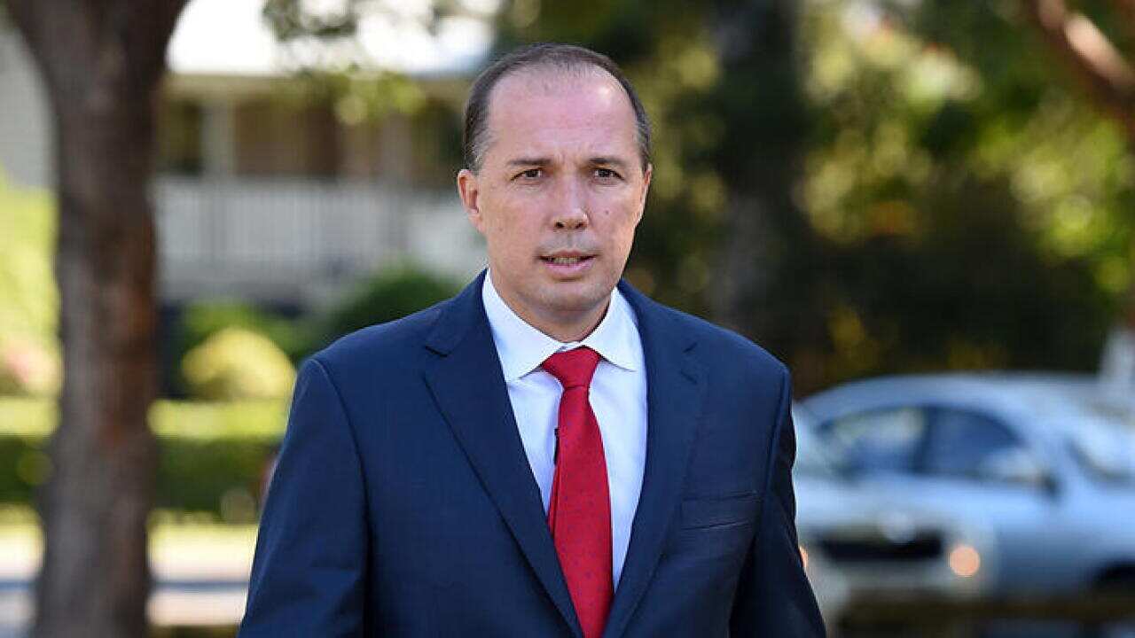 Immigration Minister Peter Dutton arrives to speak to the media in Brisbane, Friday, May 22, 2015. (AAP Image/Dan Peled) NO ARCHIVING