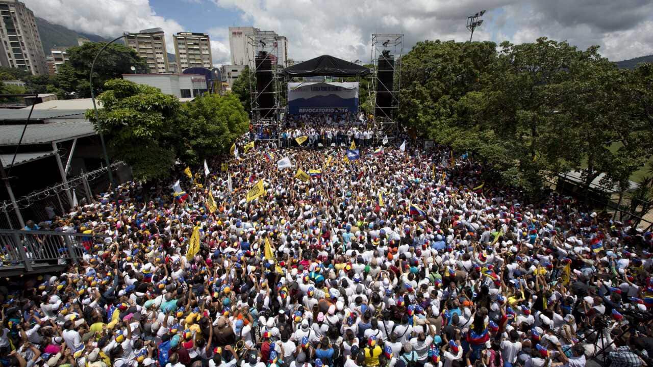 Demonstrators take part in the "taking of Caracas" march in Caracas, Venezuela, Thursday, Sept. 1, 2016.