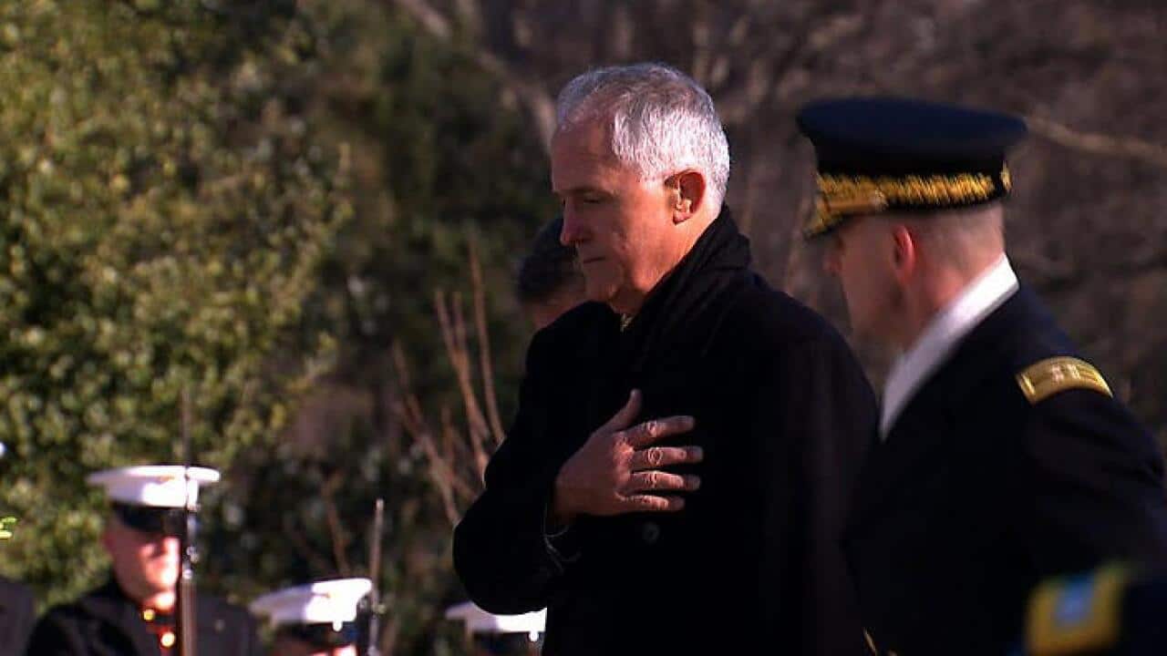 Prime Minister Malcolm Turnbull places a green and gold wreath at the Tomb of the Unknown Solider in washington DC, US. (SBS)