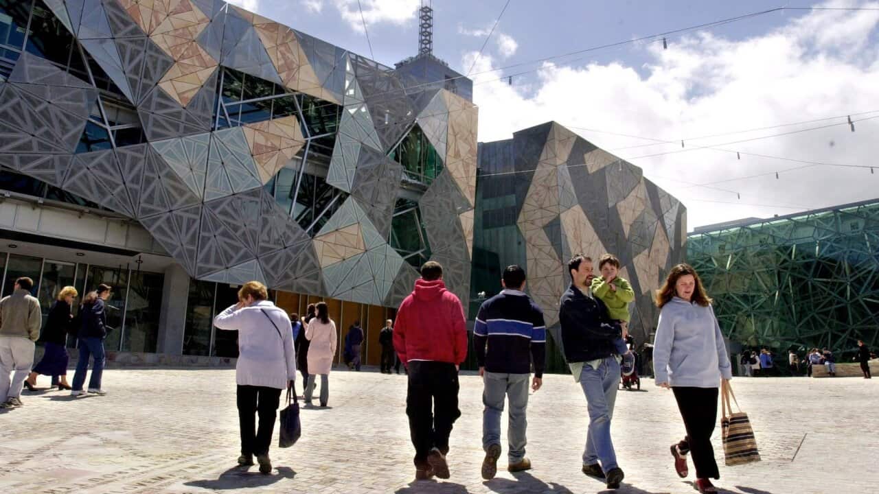 Melbourne, October 26, 2002. Members of the public inspect Federation Square which was opened to the public today for the first time by Premier Steve Bracks. (AAP Image/Julian Smith) NO ARCHIVING