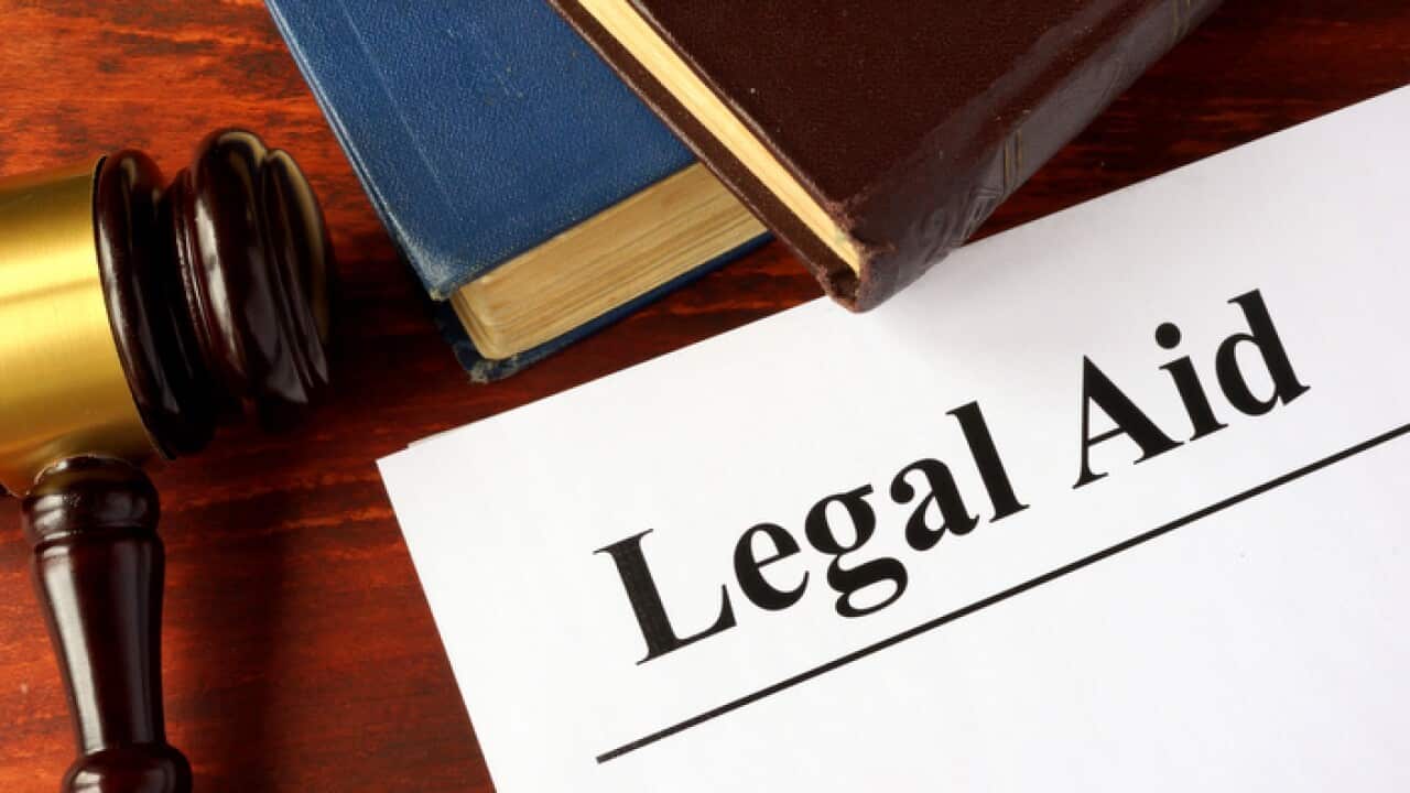 Papers with title legal aid on a table.